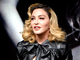 Madonna povzročila razburjenje v prosojni čipkasti obleki
